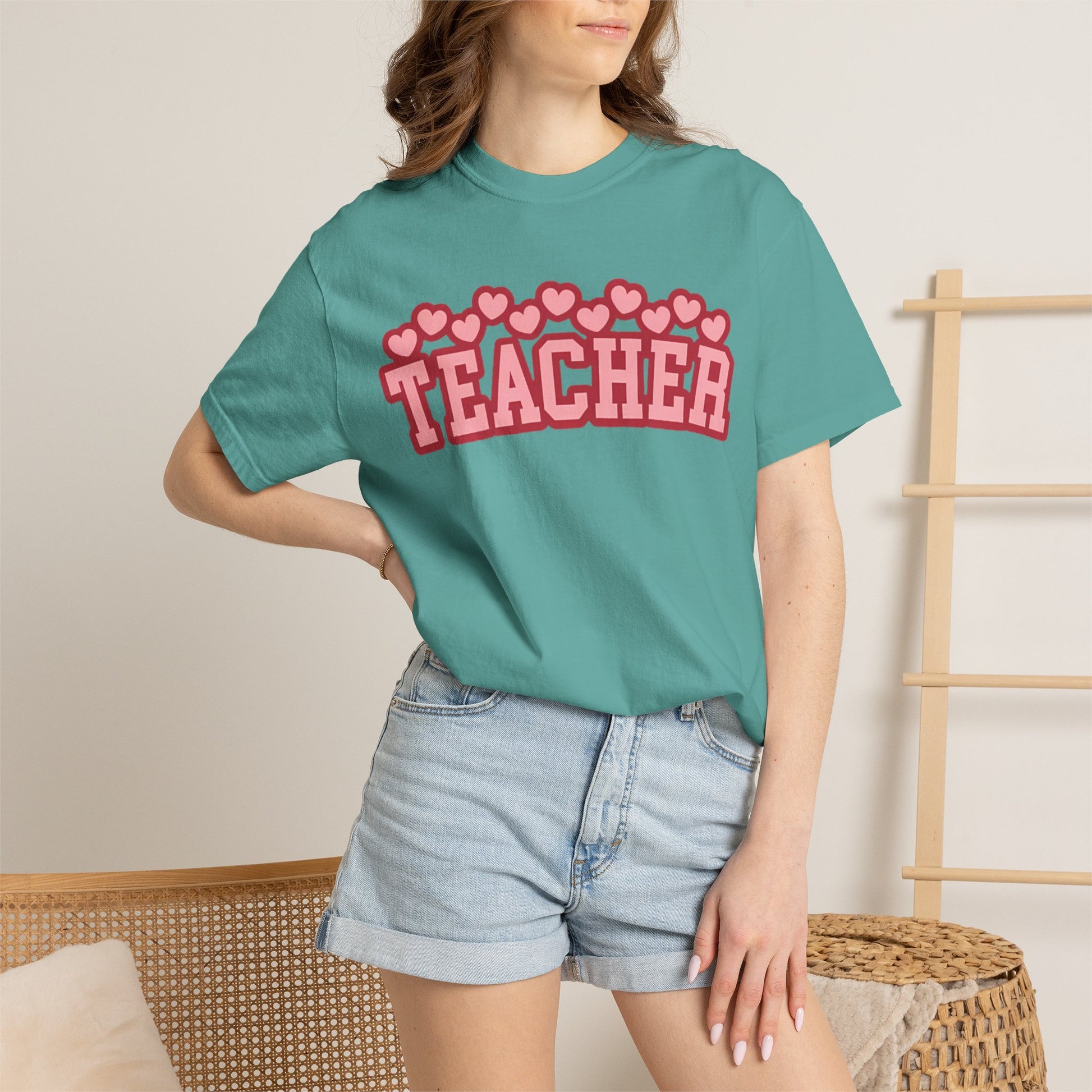 Pink teacher Comfort Colors shirt with varsity lettering and heart accents for teachers